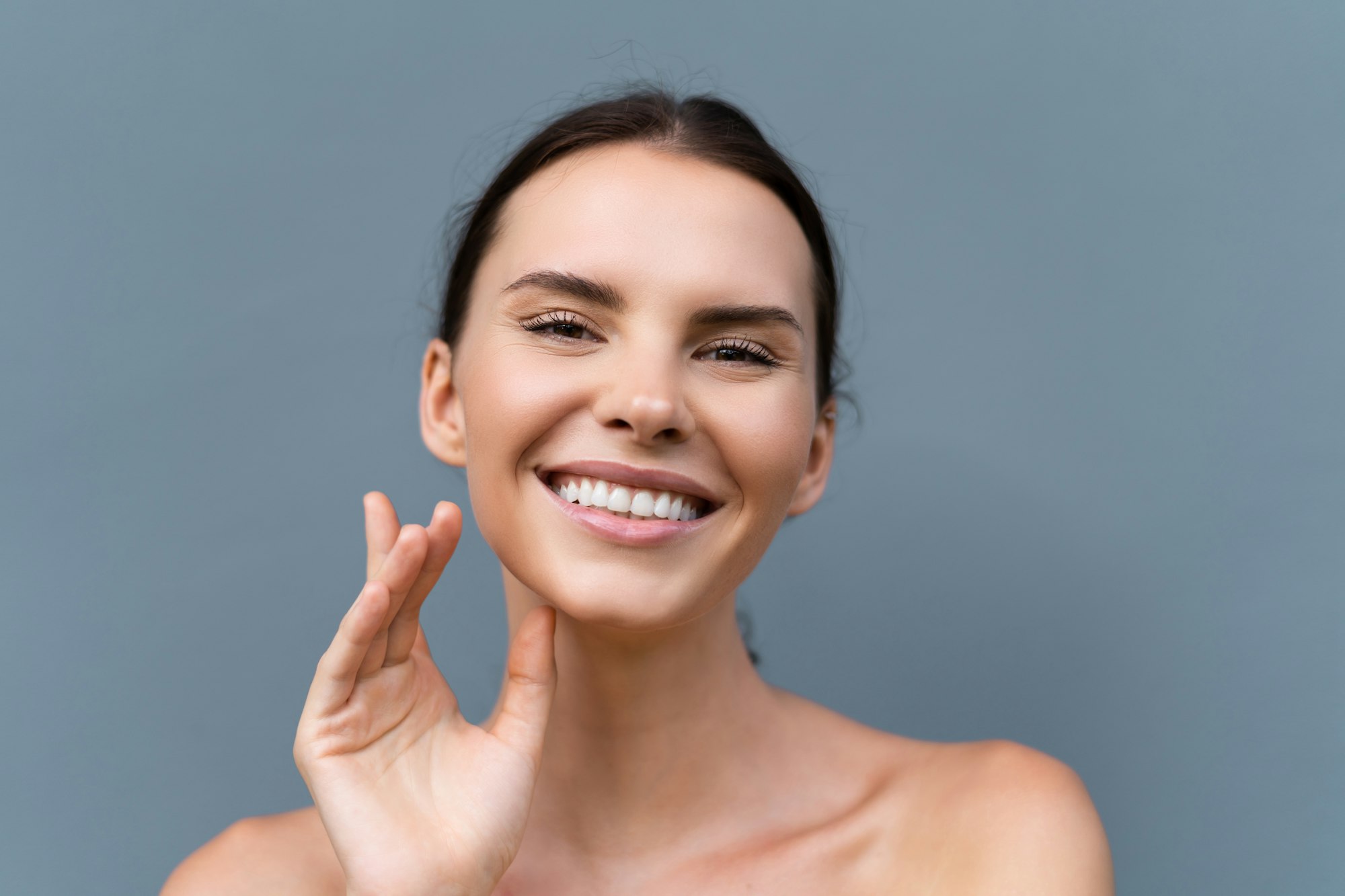 Woman with smooth, clear, even skin after Alpha Pro Laser treatment at Hideaway